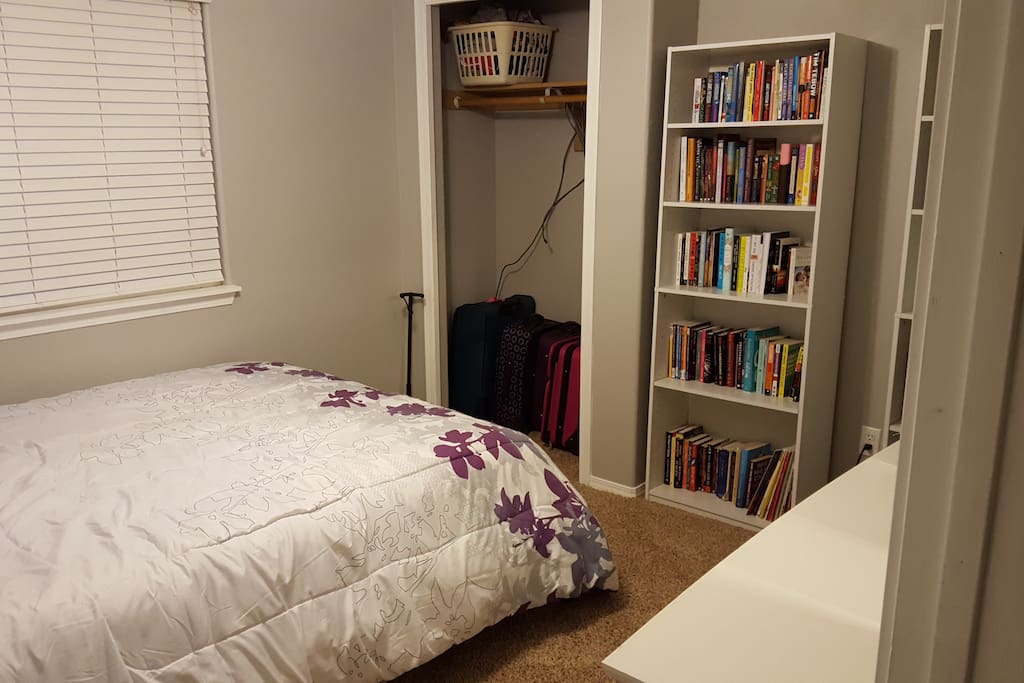 Bedroom with queen bed, dresser, and tv with Netflix capabilities