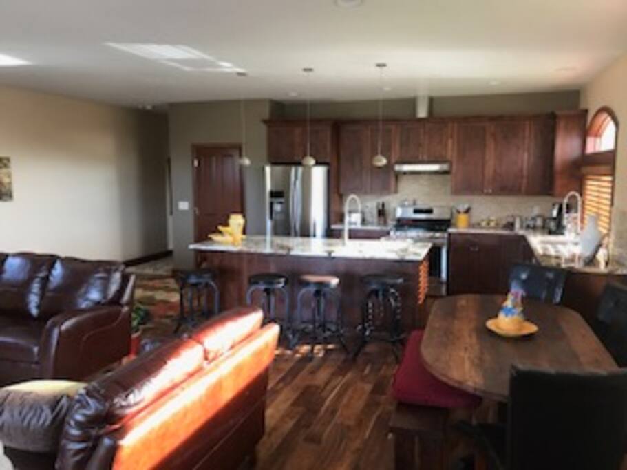 Living area looking back at full kitchen