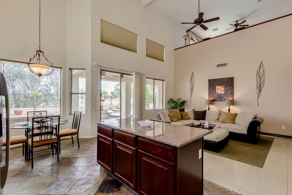 Family room, kitchen and eating area have views of backyard, pool & golf course