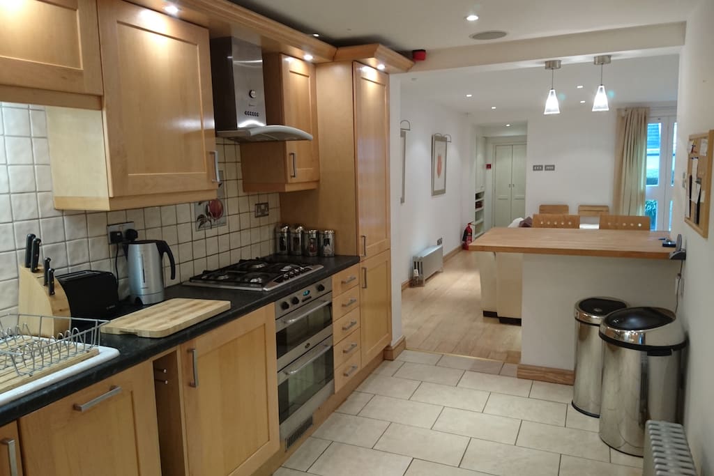 Large open plan galley kitchen with breakfast bar