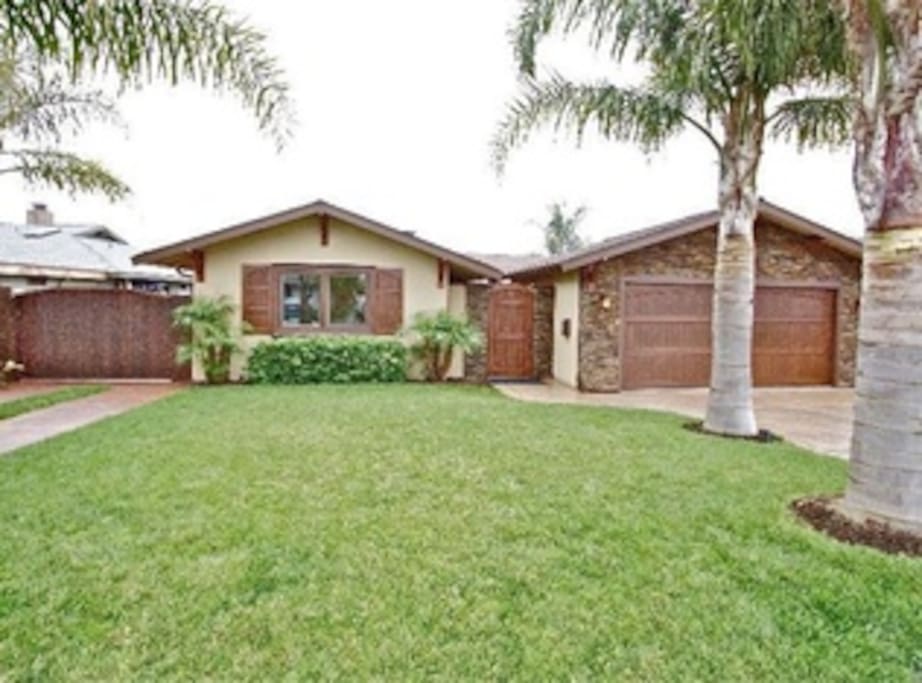Front of house; includes 2 car garage & 2 outside parking spots