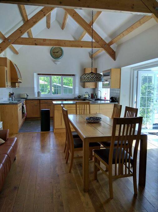 Large open plan kitchen/ diner with high vaulted ceiling