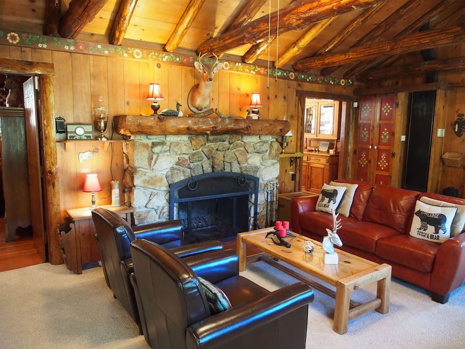 Spacious living room with original 1935 wood burning fireplace.