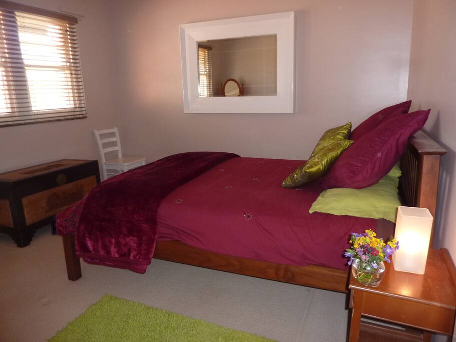 Bedroom 2 with farm views over the dam