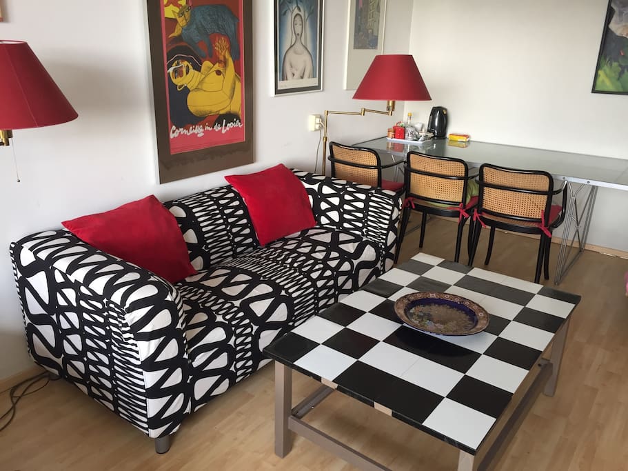 Dinner table for three at the back and our comfortable couch.