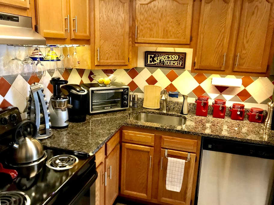 Newly updated kitchen with granite countertops, stainless steel appliances, dishwasher, garbage disposal, and electric range. Countertop appliances, such as a microwave, toaster oven, Keurig coffee maker, and upright juicer, as well as cookware, dishware, glassware, stemware, spices and utensils are all available for your use. Assortment of coffees and teas also available for your enjoyment!