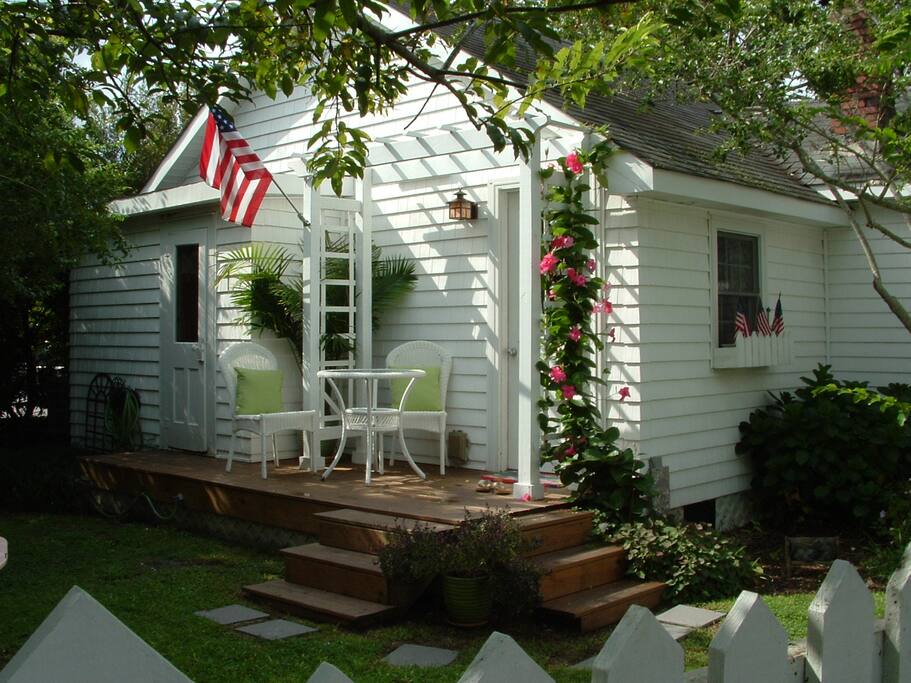 surrounded by picket fence and flowers