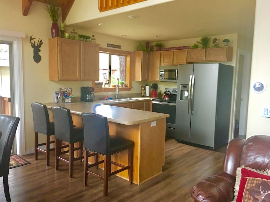 Kitchen features all new appliances, breakfast bar as well as dishes, pots, pans, utensils and all you could imagine for meal prep!
