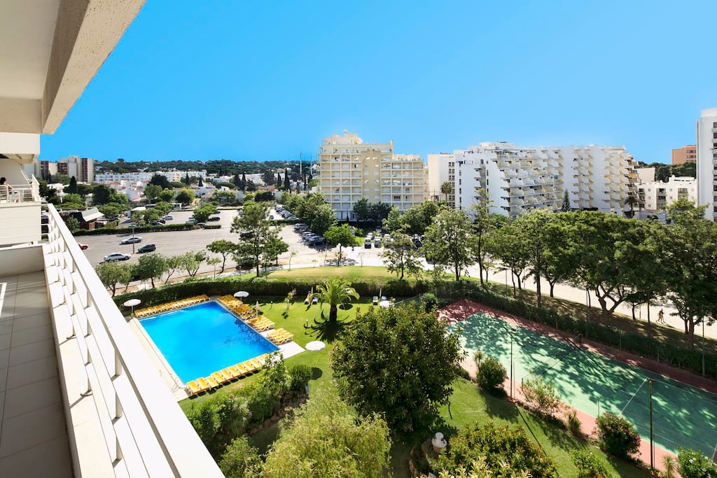 This is the swimming pool of the complex and tennis court