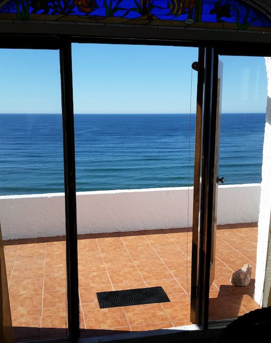View to the west from the living room door to the ocean front patio