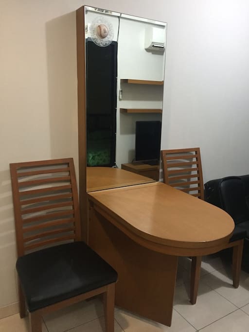 Collapsible dining table to increase space when needed