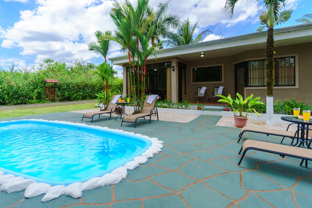 The perfect spot to spend an afternoon;deck chairs, pool, volcano view, sunshine.