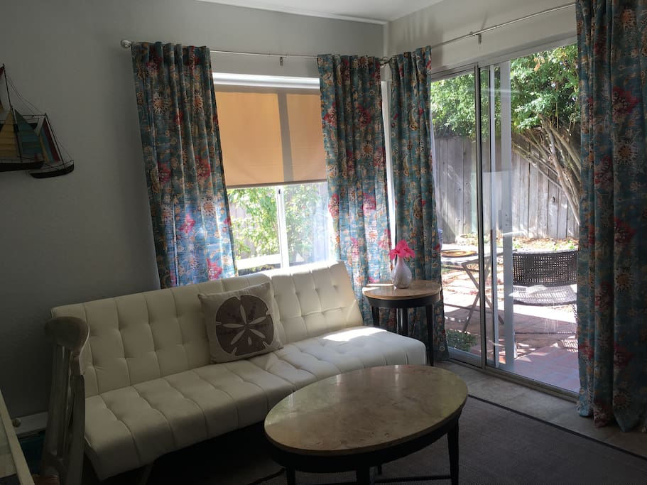 This is your guest cove located next to our outdoor patio. The futon sofa opens as a full bed with a topper mattress on top.