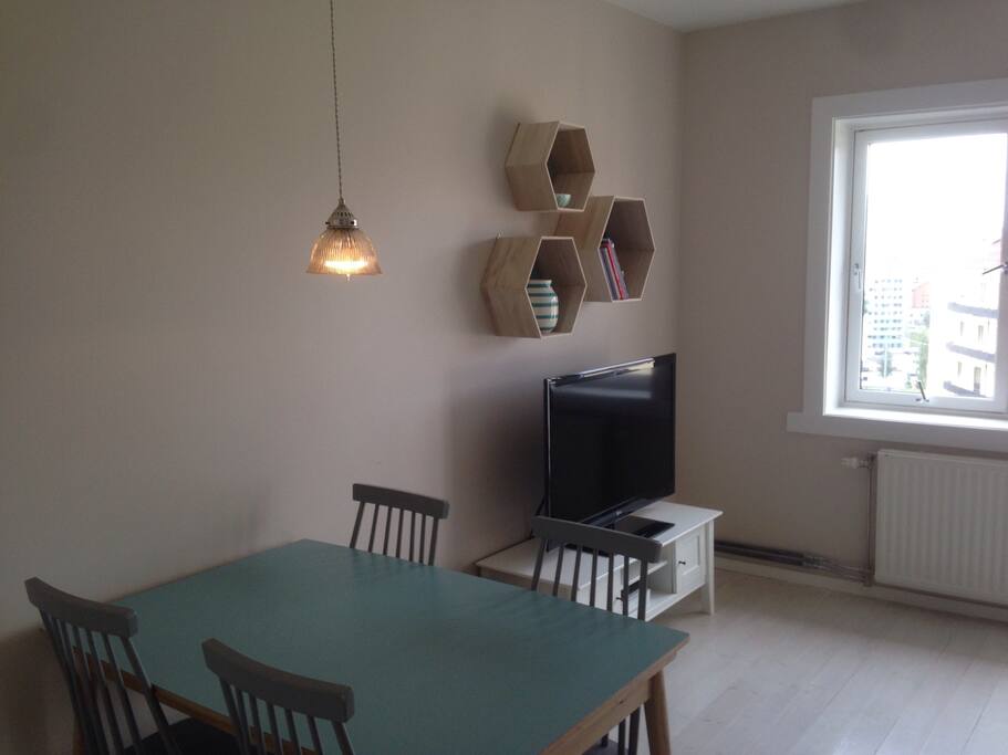 Dining area with a TV behind.