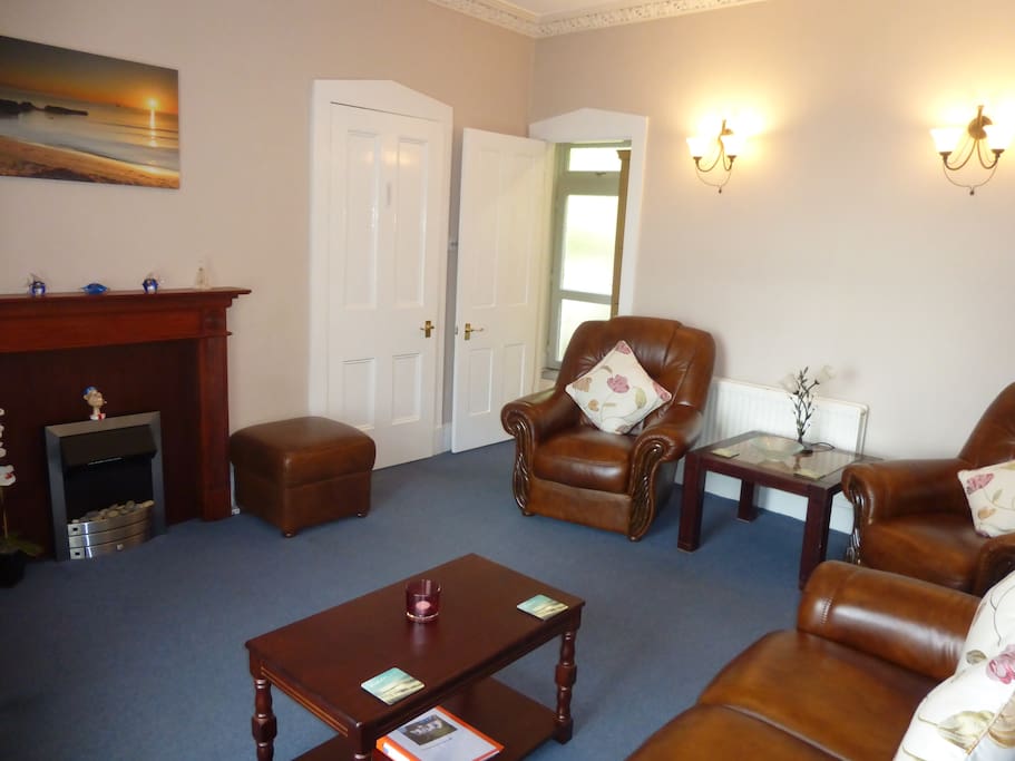 A Spacious Quality Furnished Living Room with Sea Views