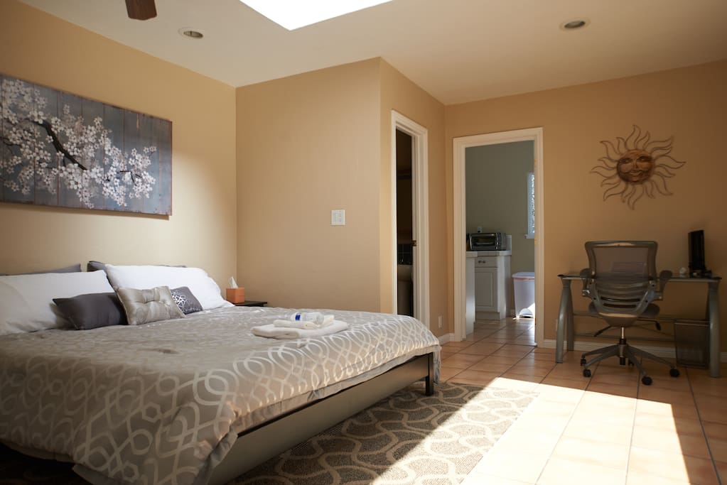 Bedroom #1: Bright and airy with a sunlight and large bay window. Executive desk and chair in the bedroom.