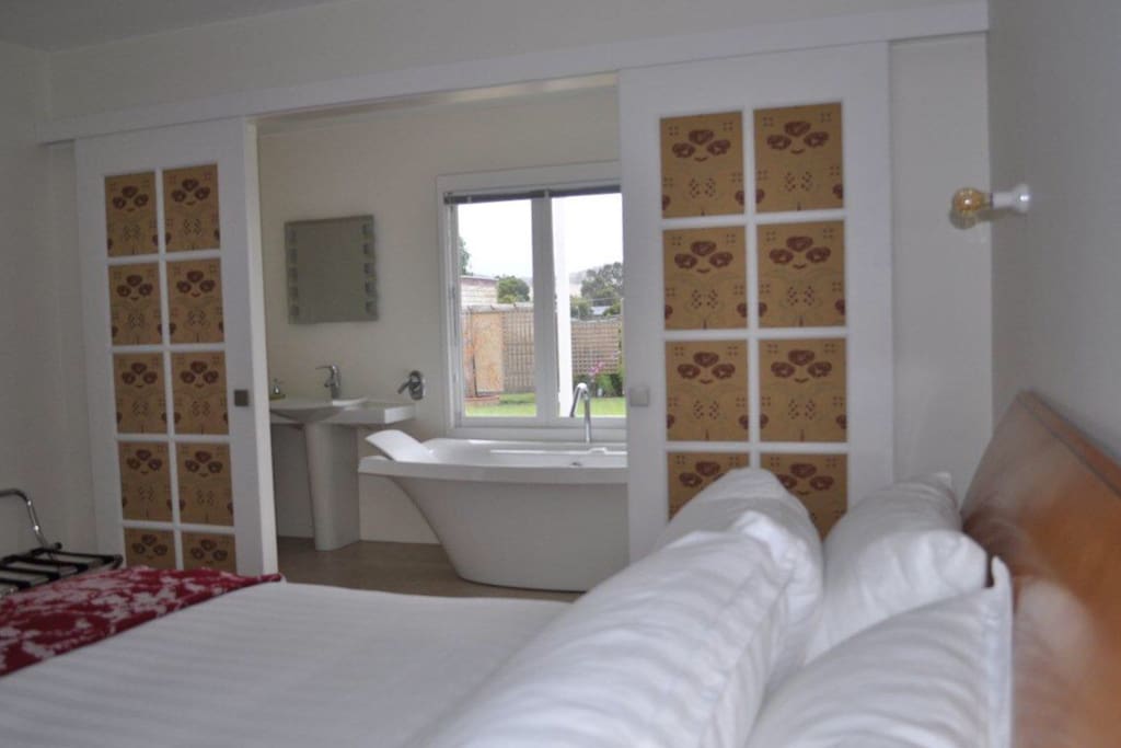 Bedroom opens up to the luxury ensuite with a view