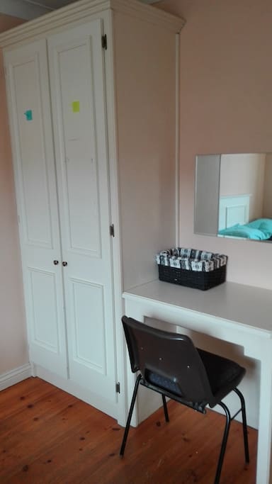 wardrobe, desk and chair in the bedroom