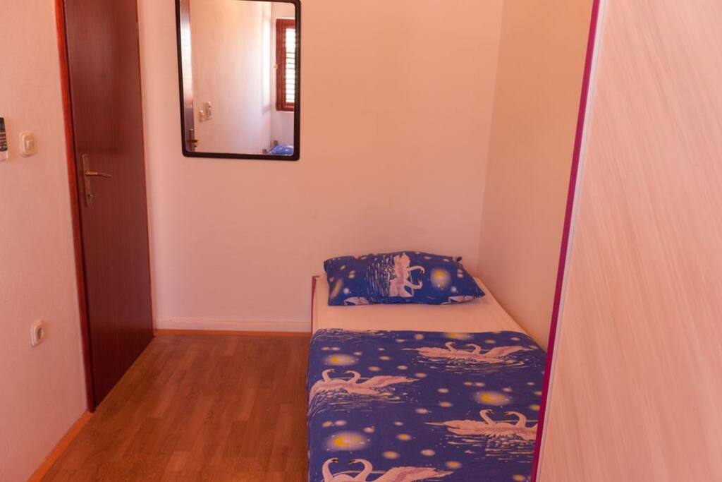 Private bedroom with two single beds
