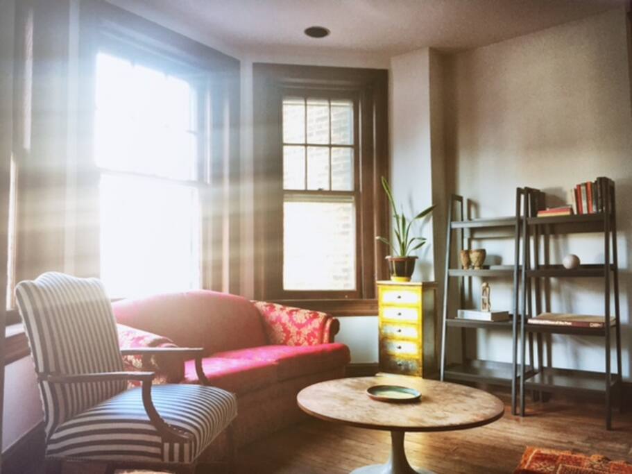 Read, relax, or entertain in your private sitting area with bay windows