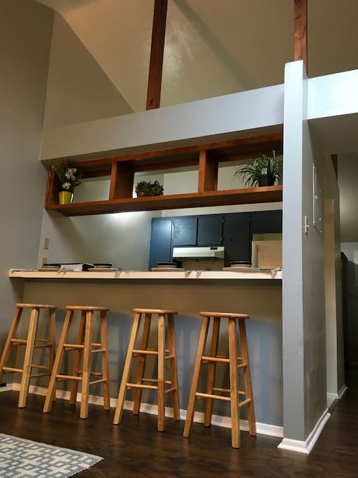 There are high ceilings, raw wood beams, and a skylight that all open up the space. The one-bedroom apartment has all new wood flooring and paint.
