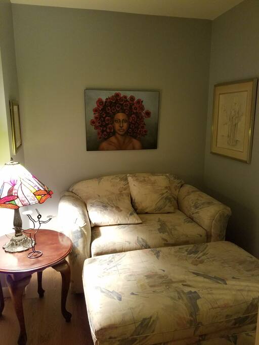 This is a single sleeper couch in sleeping room 1. With the ottaman, it's a great place to work on your laptop.