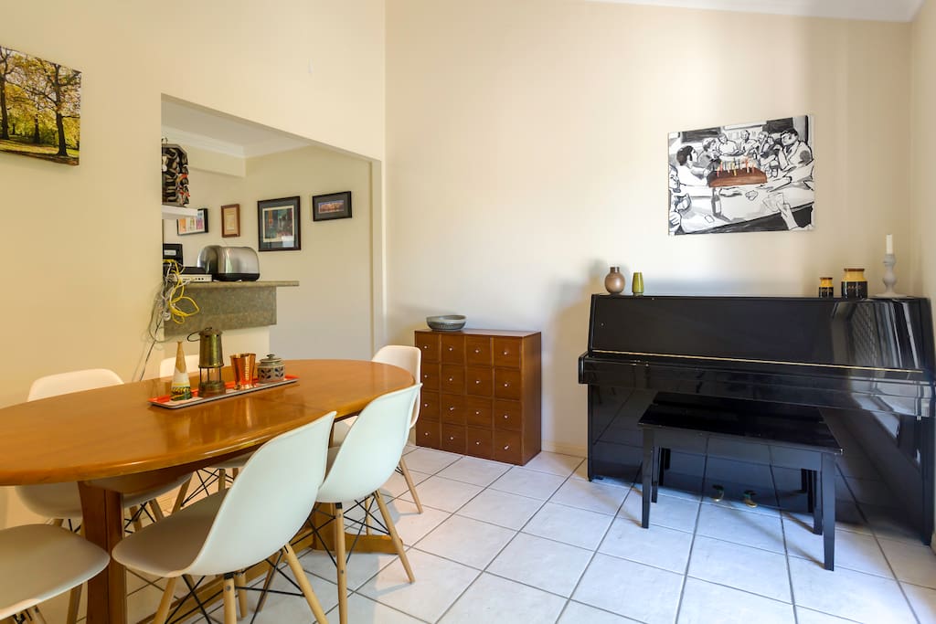 Dining room with piano for your enjoyment.