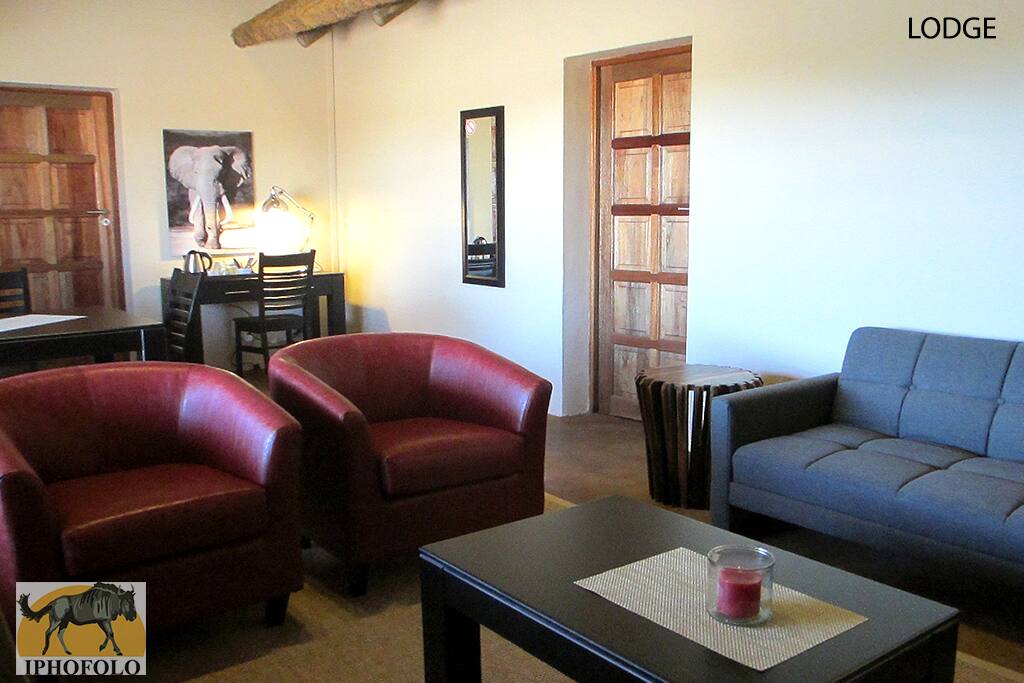 private living space with TV, wifi, desk, chairs, sofa
