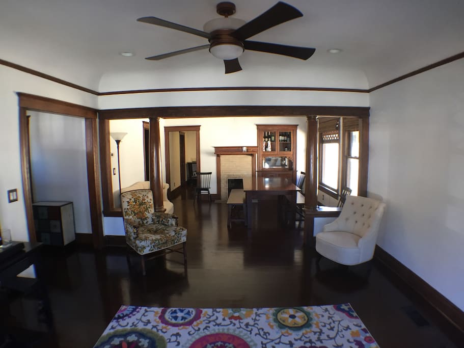 Fully restored original built-in cabinet and original wood work makes this open living room and formal dining room a great space to relax, work, or to be creative.