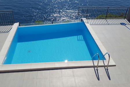 Amazing apartment on beach+huge terrace+pool