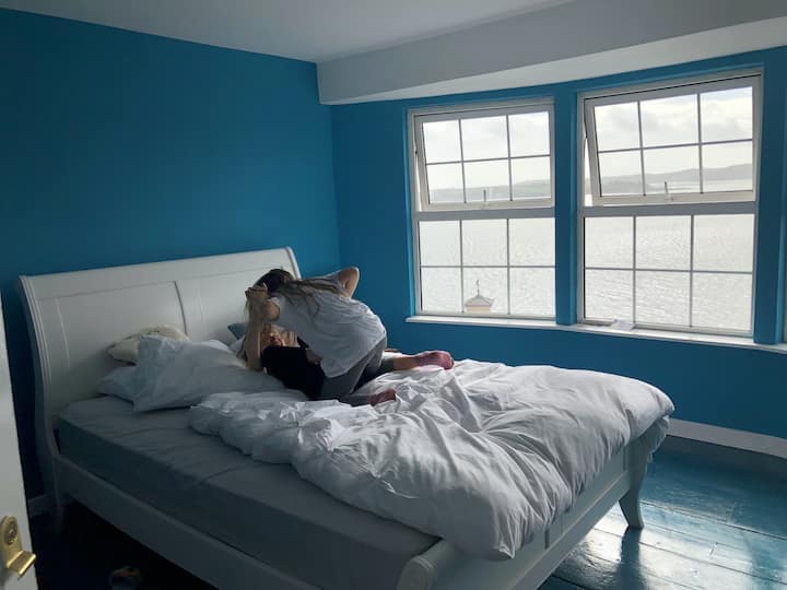 The third floor bedroom with its panoramic views over the harbour has a king size double bed as well as a single bed...