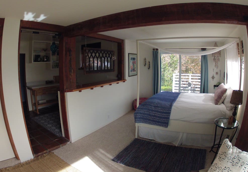 From sitting area towards bed and kitchenette