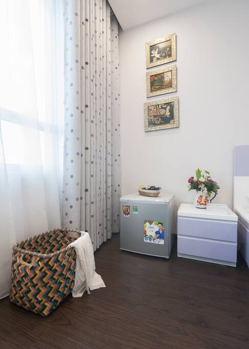 A room corner with mini fridge