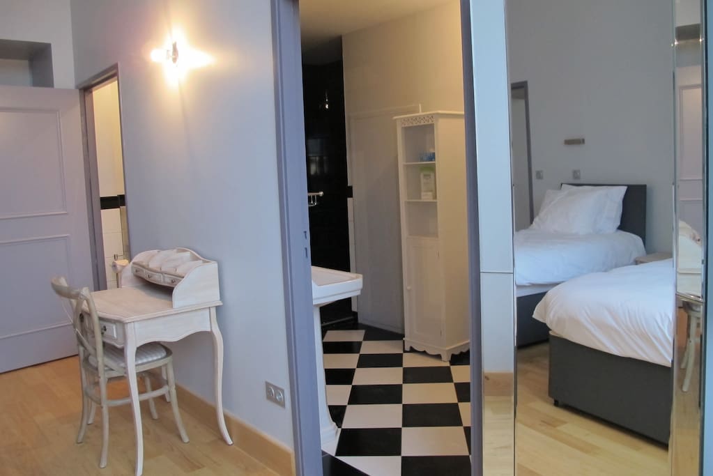 Bathroom has bath and shower.