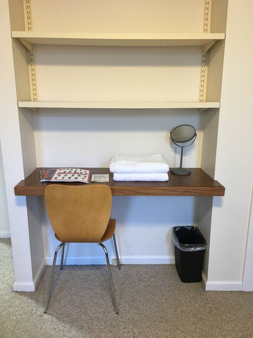Built in desk with chair and outlet if you need to work. Mirror, towels, Columbus magazines.