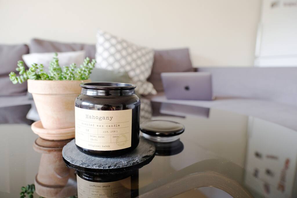 Candles and toss pillows make for a homey touch.