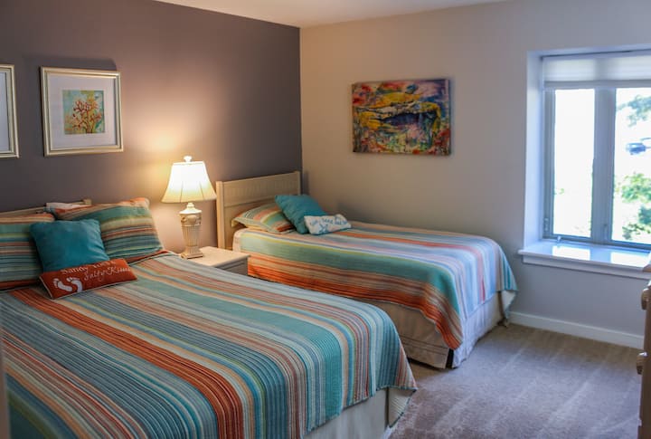 Guest bedroom features 1 queen and 1 twin bed