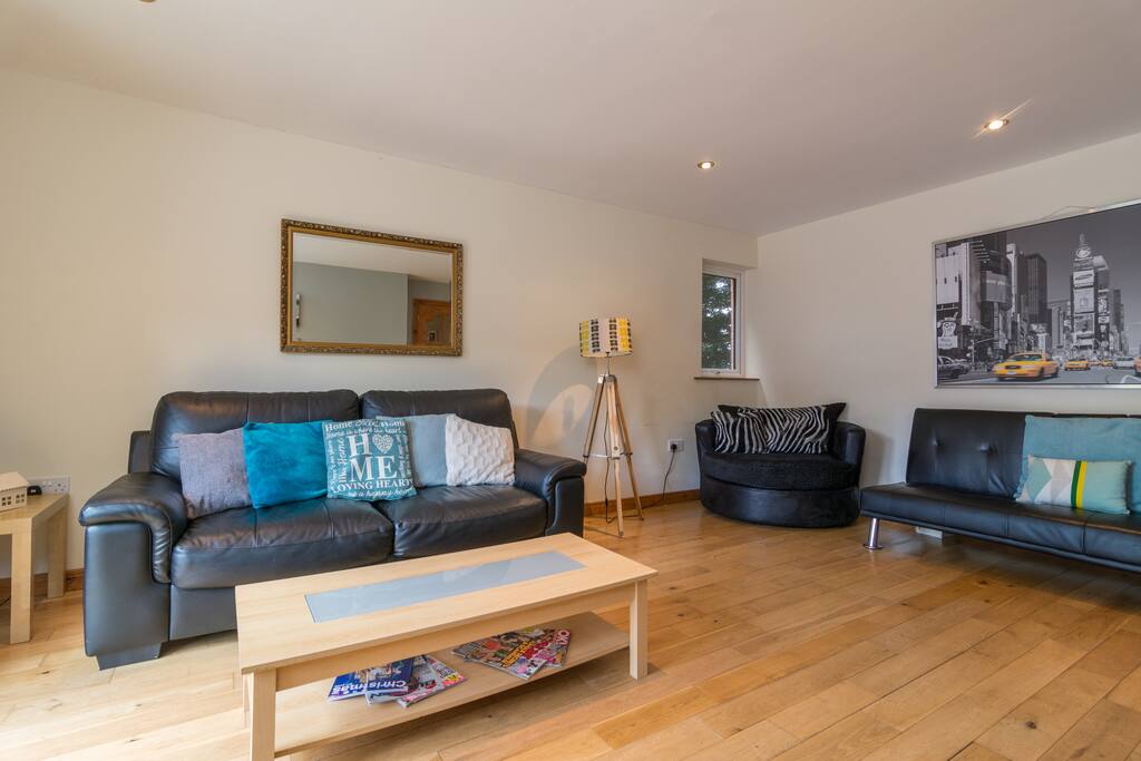 Huge Living rooms - wooden flooring throughout