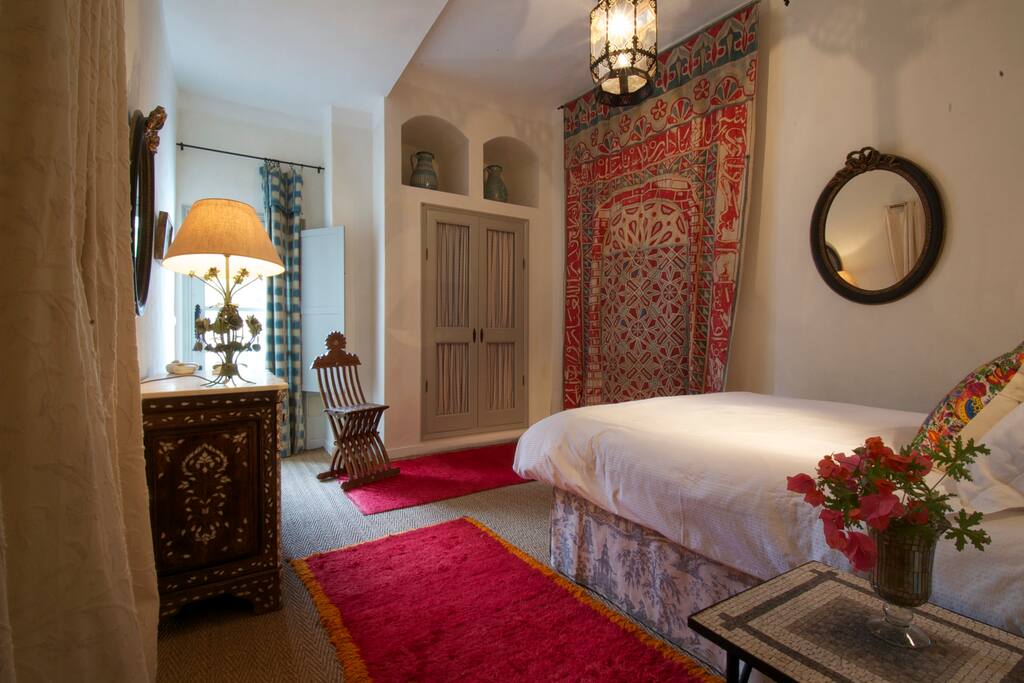 Master bedroom with door to swimming pool terrace.