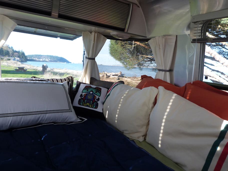 Queen bed with panorama windows, at Point Hudson