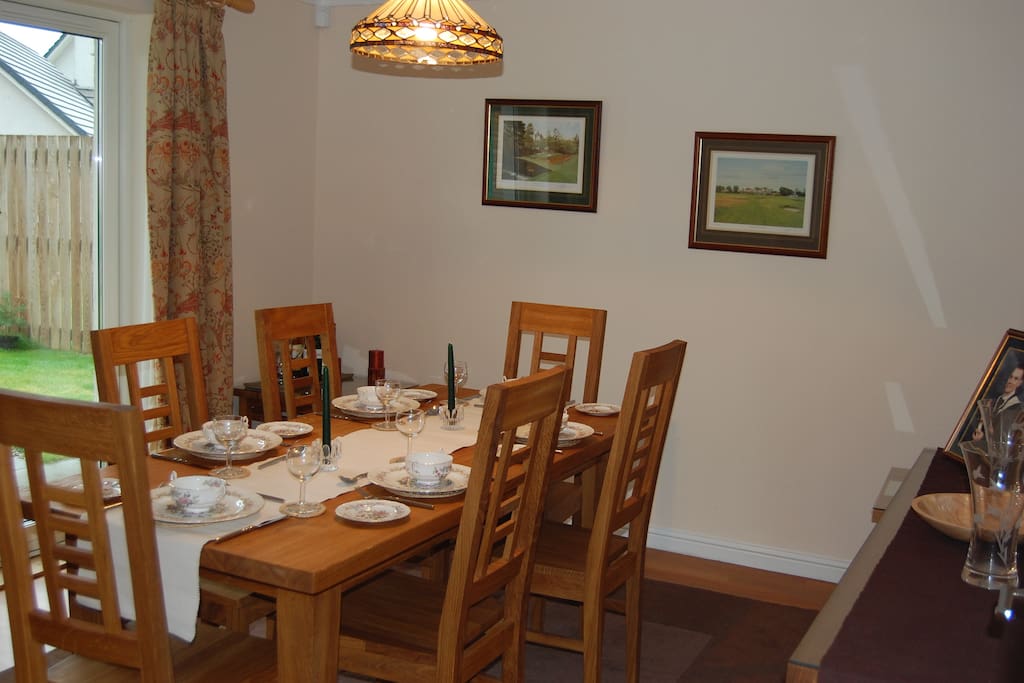 Dining room with patio doors on to enclosed back garden.