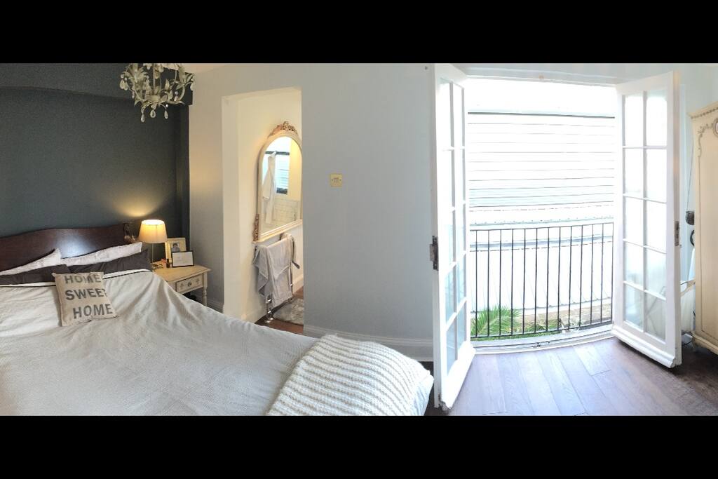 Large bedroom with double bed, big ensuite bathroom with separate shower and nice double doors opening up to a juliet balcony.