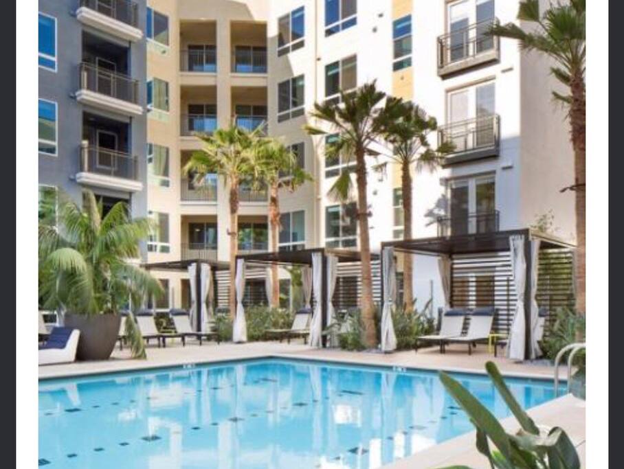Large salted pool with cabanas, jacuzzi and bbq areas.