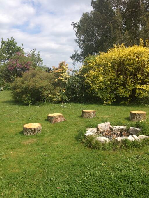 Fire pit with plenty of wood available to burn