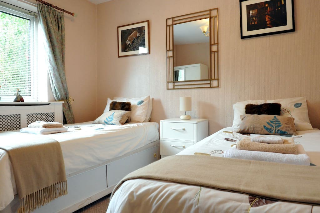 Bedroom 2 with twin beds. Ground floor with a bright front garden aspect.