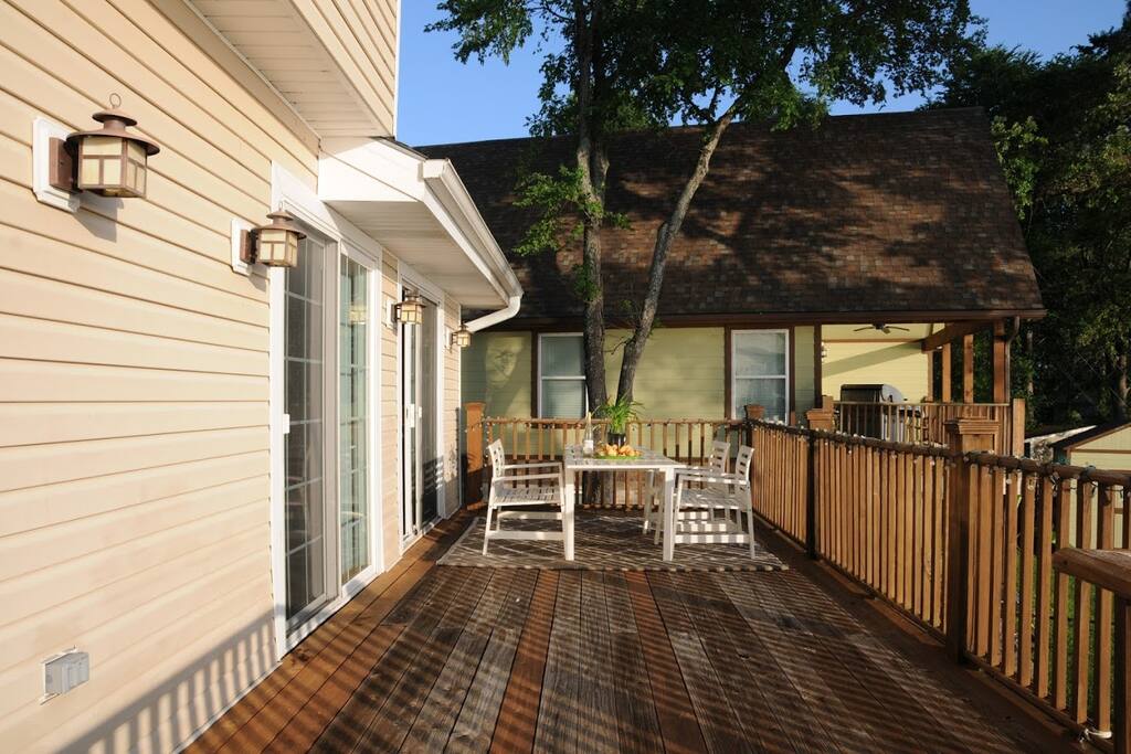 Two sets of french doors open up to the second floor patio overlooking the lake.