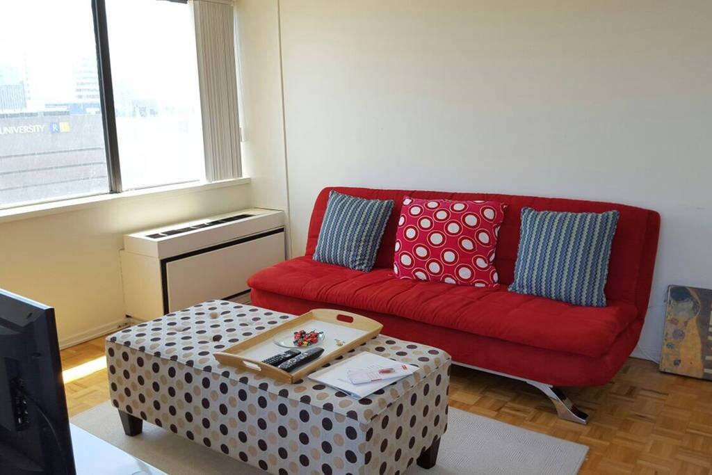 Spacious Living room with wraparound views of the city!