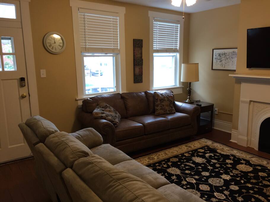 The living room showing the front entrance