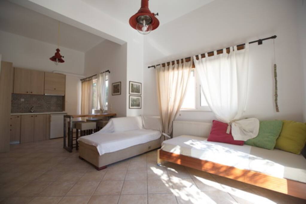 Kitchen and sitting room, access to small balcony and yard behind