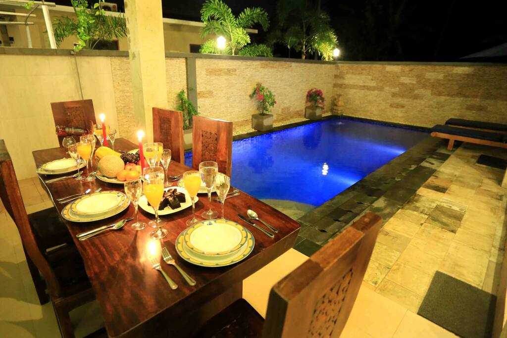 Open dining area next to the swimming pool.